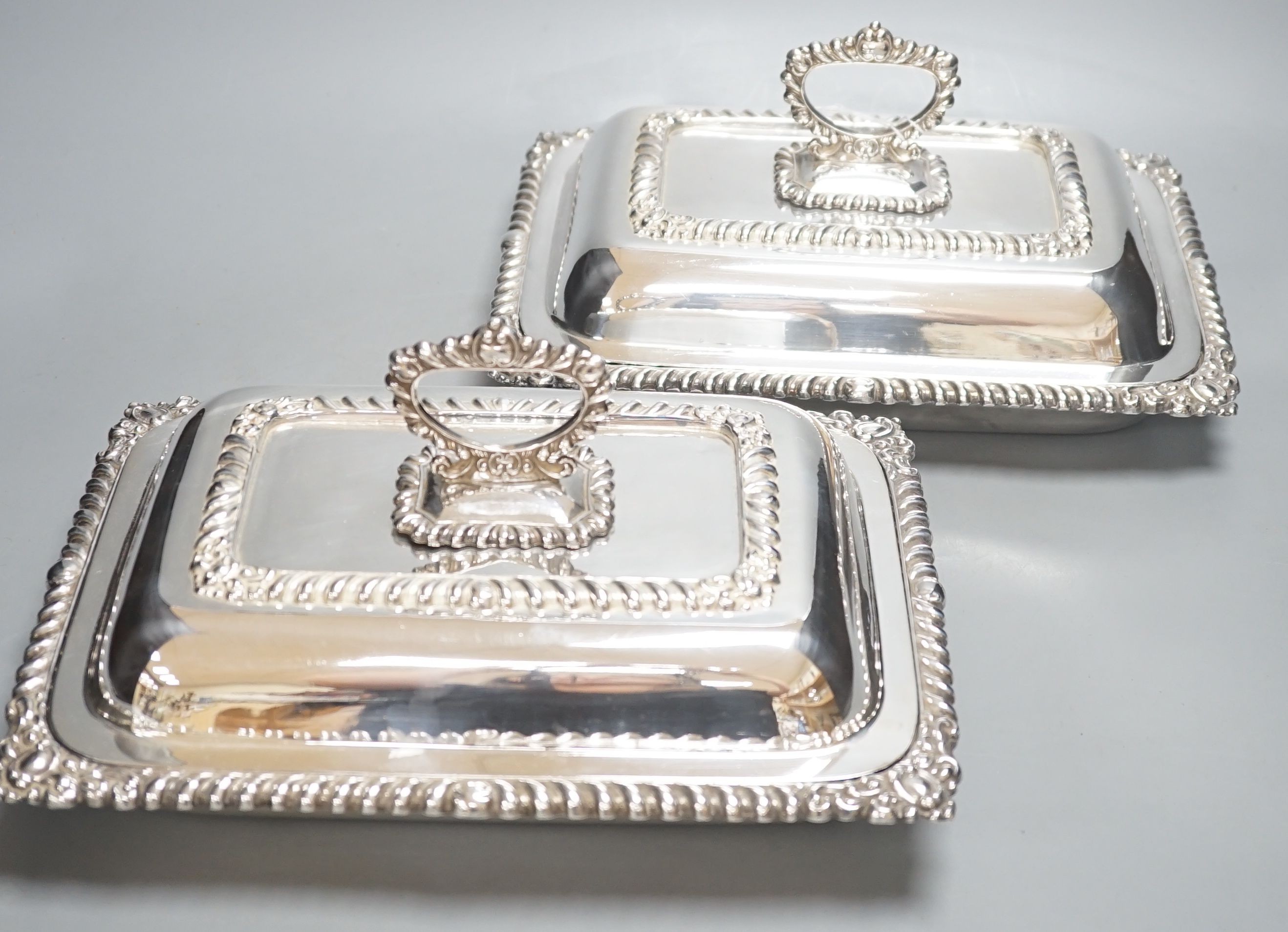 A pair of silver plated entree dishes, 28cm